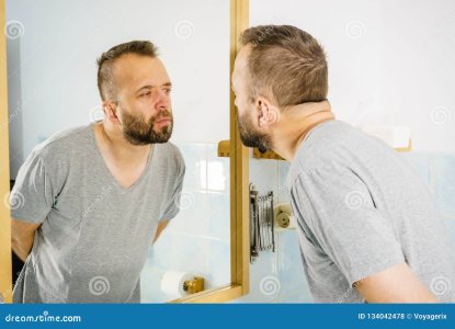 man-looking-himself-mirror-adult-man-looking-himself-bathroom-mirror-guy-to-do-his-morning-hyg...jpg